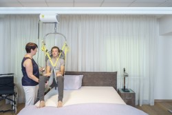 Ceiling hoist - with motor fixed on the rail ; The freedom bridge - Handi-Rehab Patient lift hoist